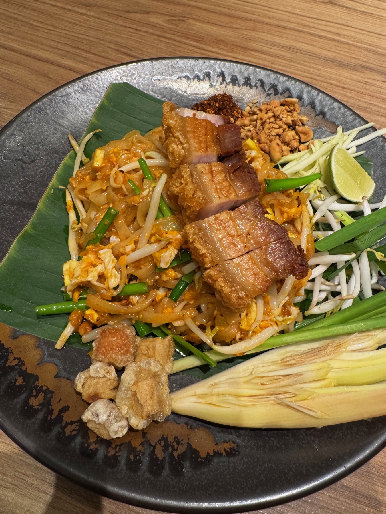 A casual Bangkok food stop on a dark plate