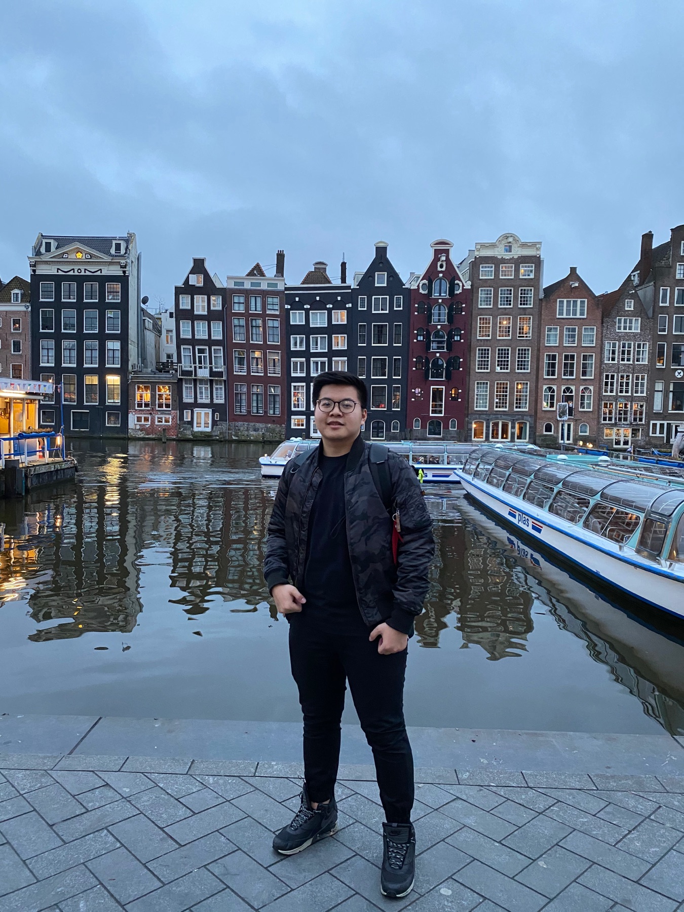 Winter canal walk in Amsterdam with travel companion in the frame
