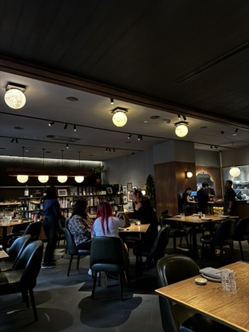 Warm dining room interior at August Jakarta during dinner service