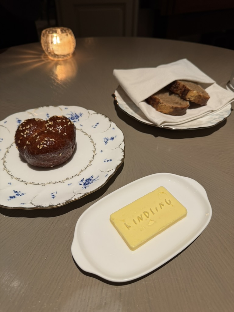 Bread, brioche, and Kindling butter on the dinner table