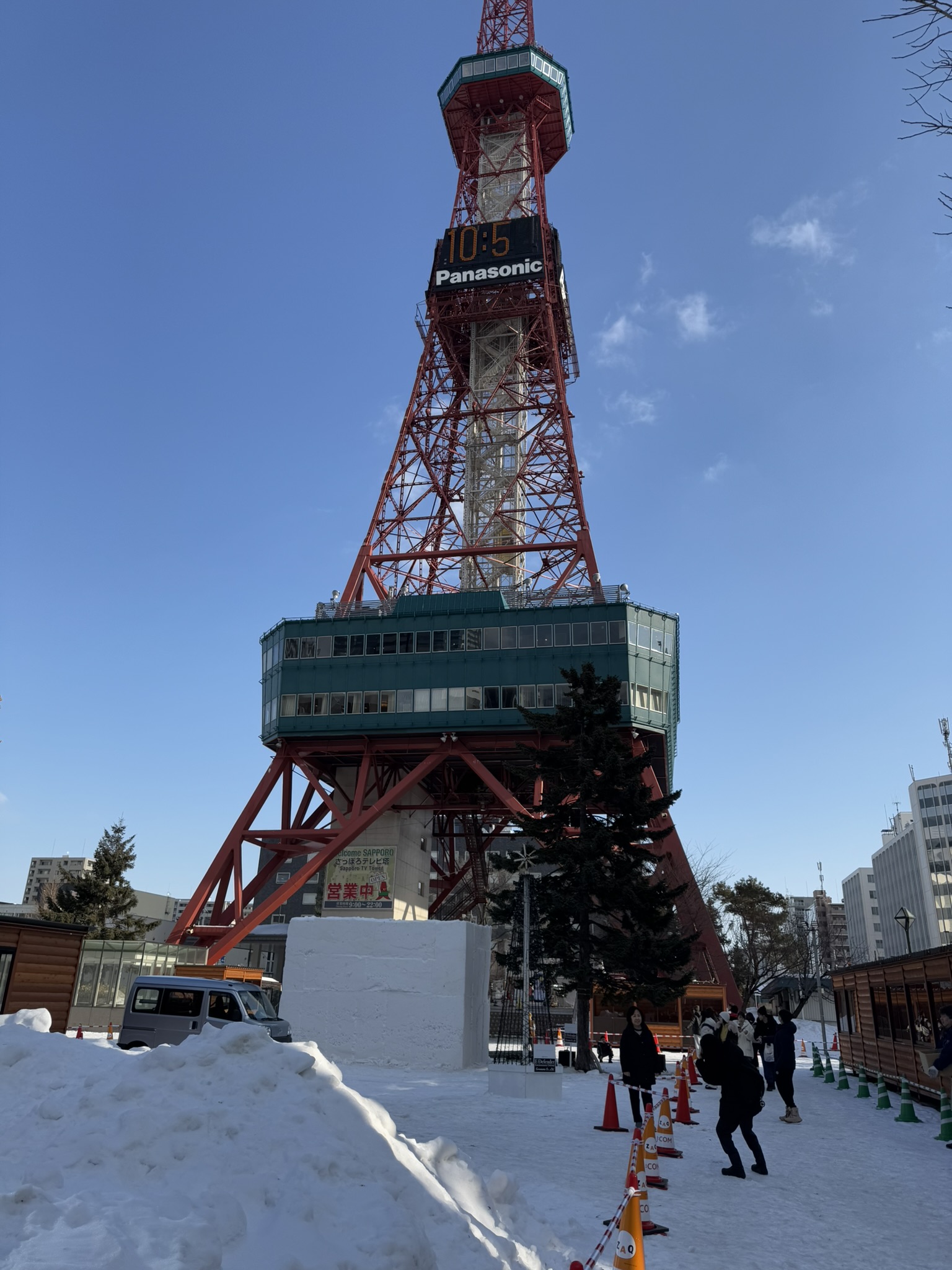Close view of Sapporo TV Tower with snow around the base