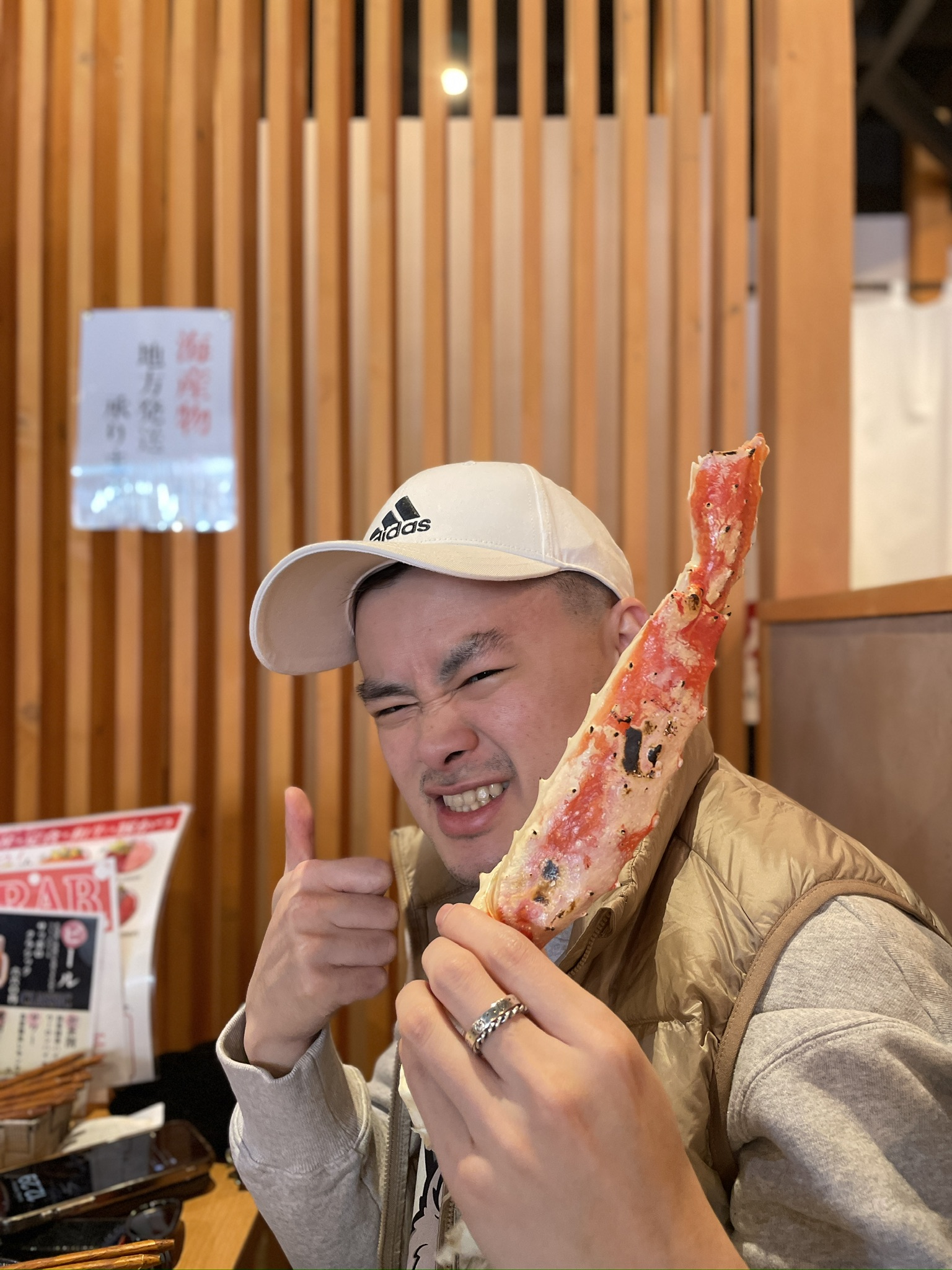 Holding a king crab leg during lunch in Sapporo