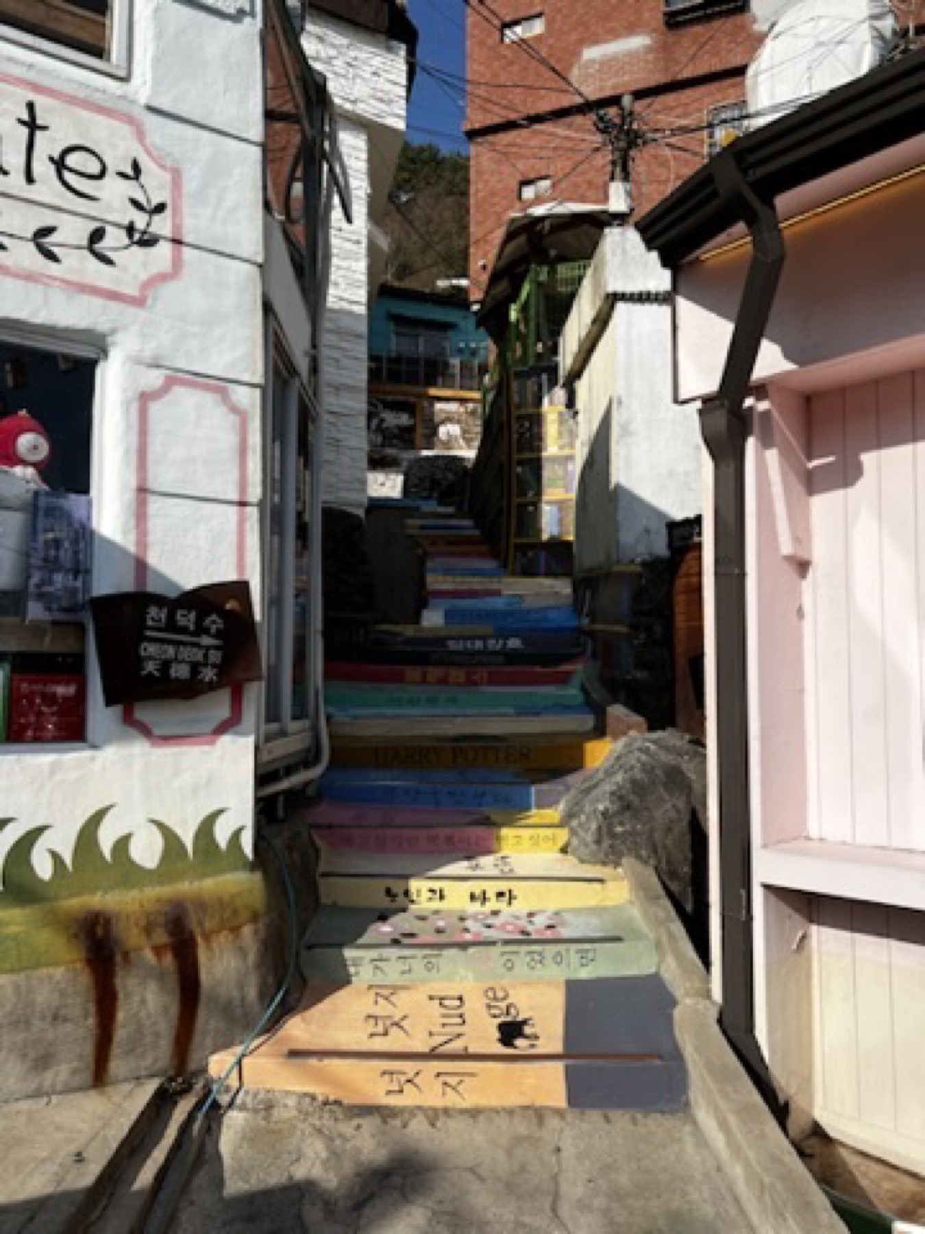Colorful stepped lane in Busan with painted stairs and pastel walls