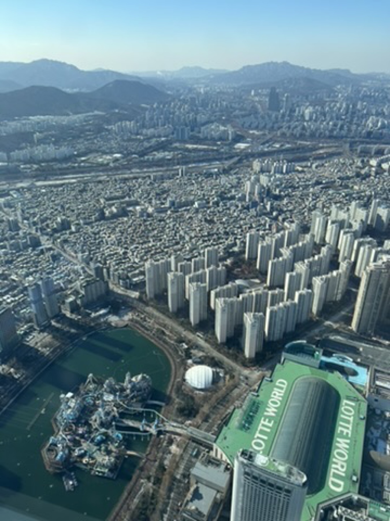 Aerial view of Seoul apartment blocks and city grid from above