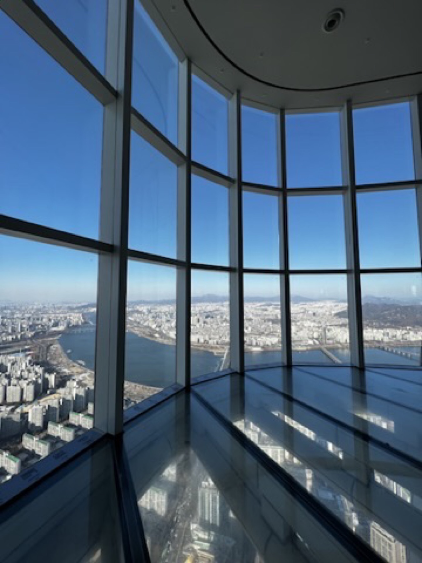 Wide Seoul skyline seen from a high observatory window