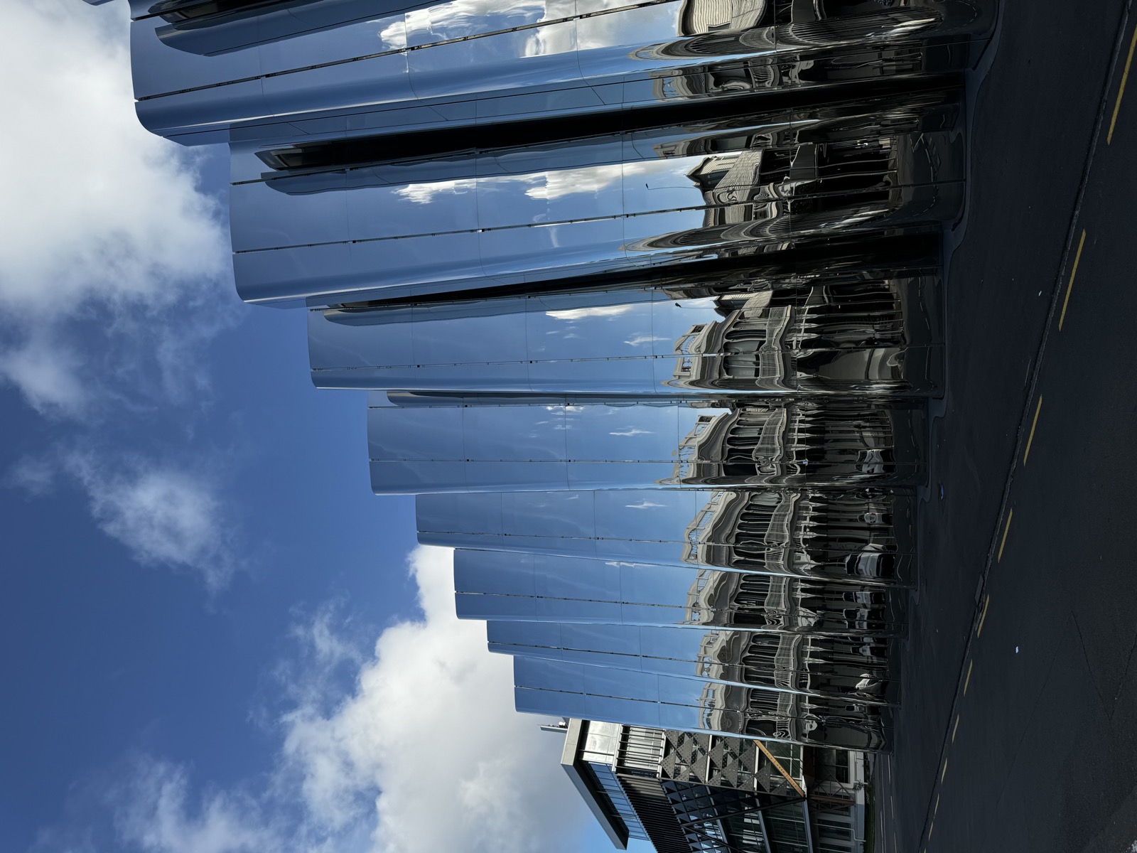 Reflective mirrored building in New Plymouth under blue sky