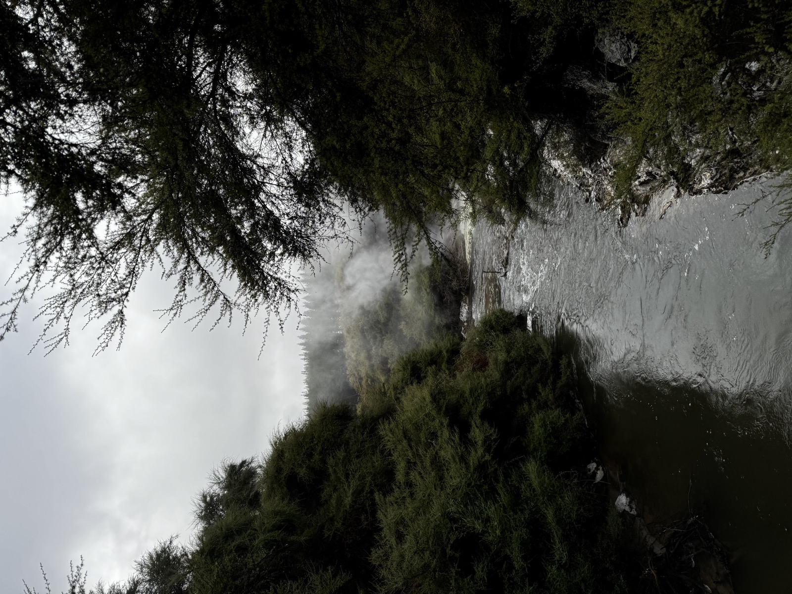 Geothermal steam rising from a rocky Taupo-area landscape