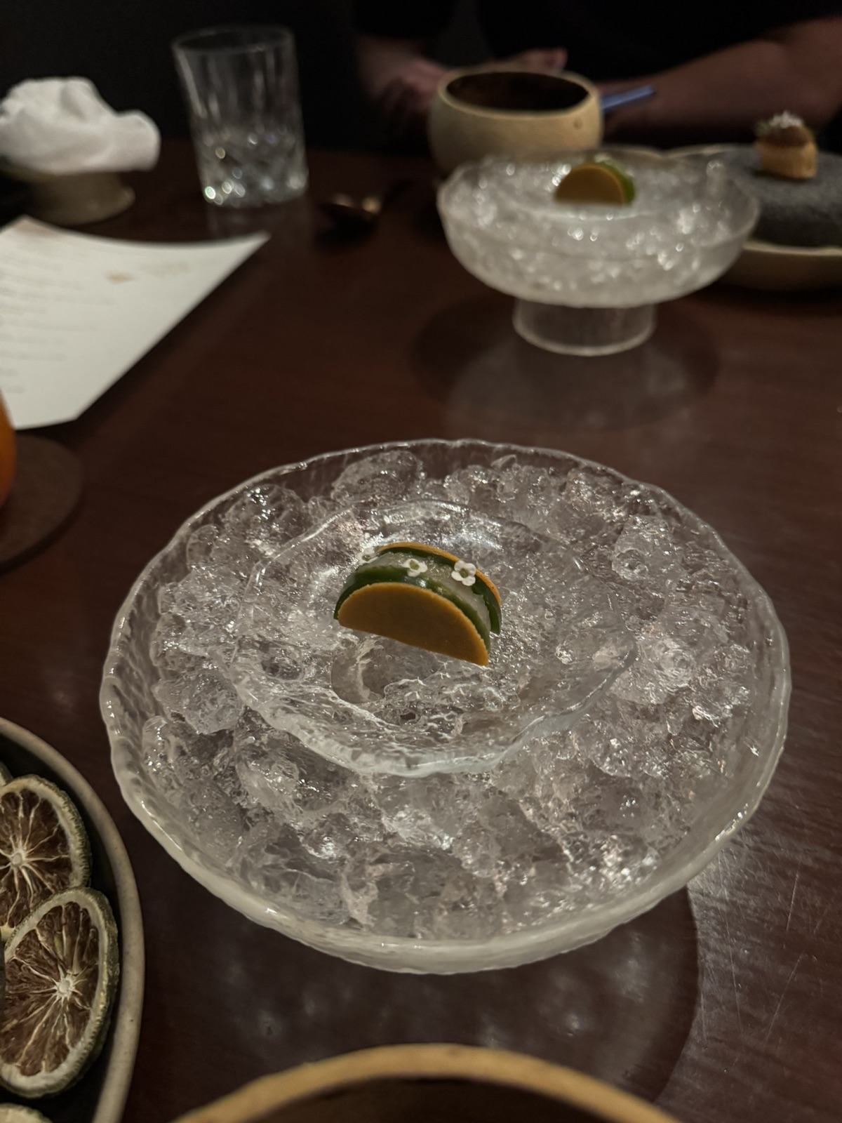An iced Saawaan course with small green slices arranged around a pale center