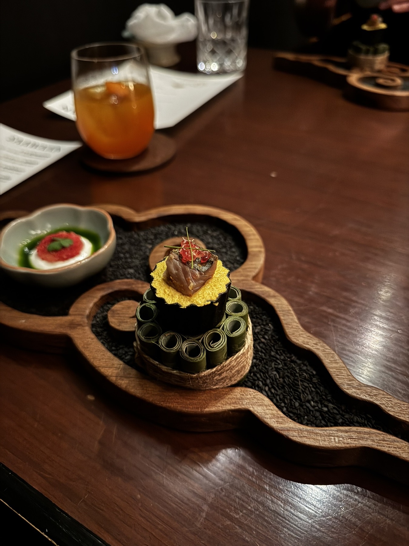 A sculptural Saawaan Bangkok course served on a wooden tray