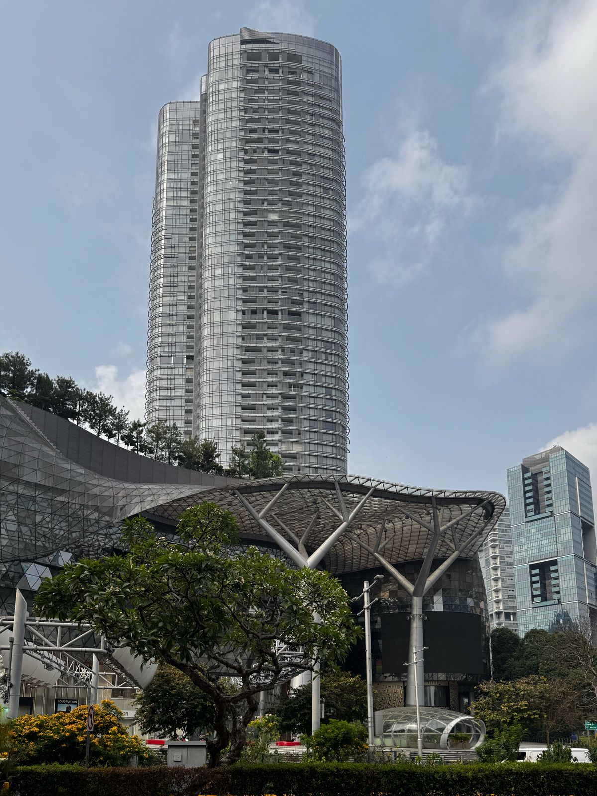 Tower block and covered walkway on Orchard Road in the morning