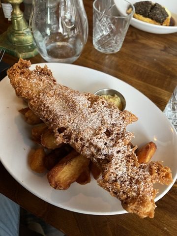 Crisp fish and chips on a restaurant table