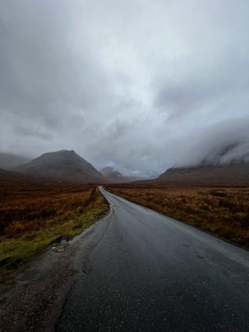 Moody road through the Scottish Highlands