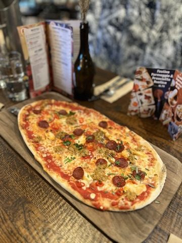 Flatbread pizza on a restaurant table